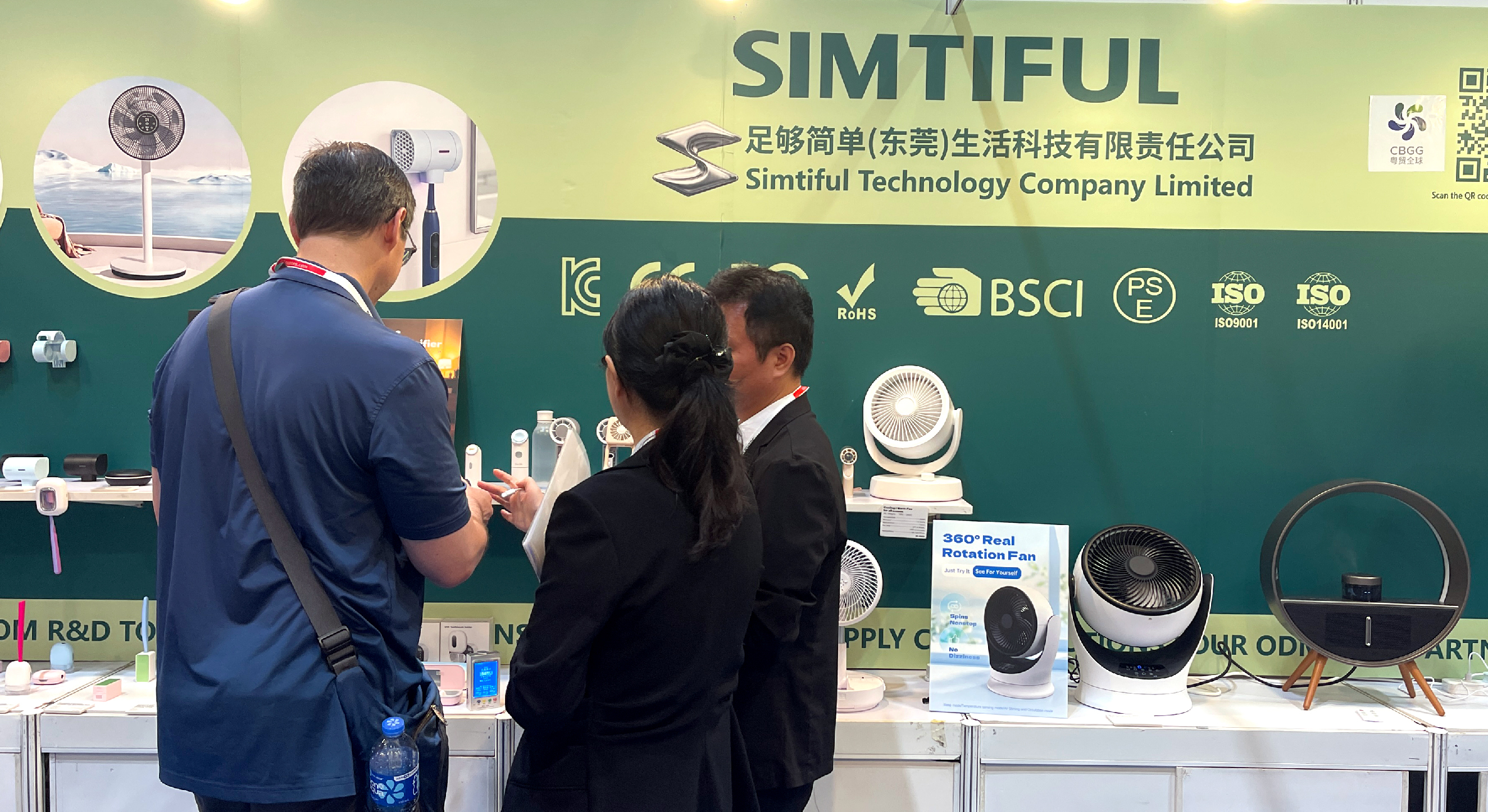 Buyers reviewing SIMTIFUL products at the booth